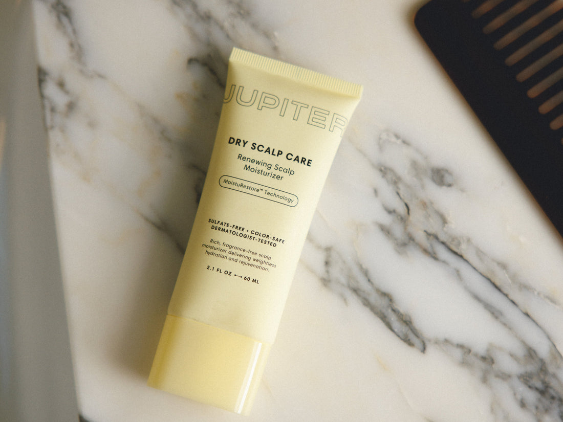 Photo of the Daily Hydration Renewing Scalp Moisturizer on a marble table top