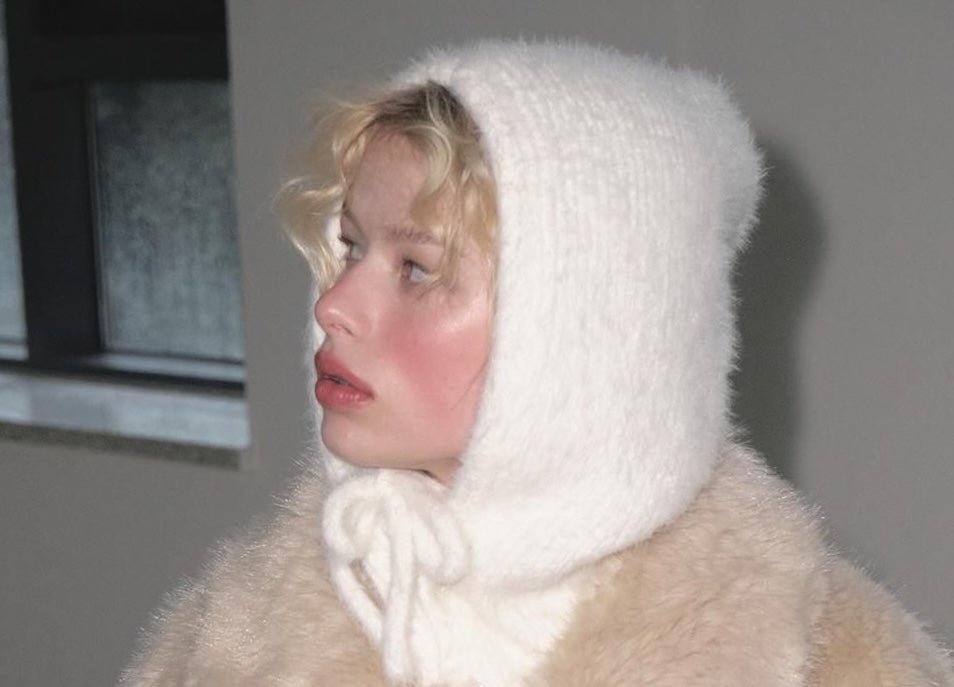 Image of a woman in thick, winter clothes