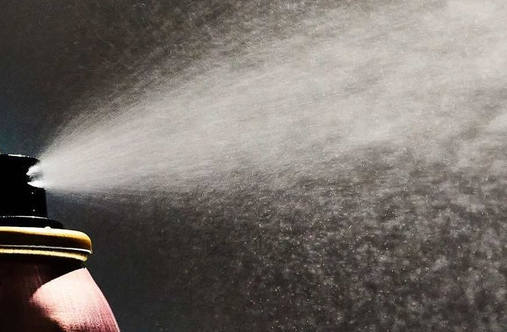 Photo of dry shampoo sprayed out of the bottle