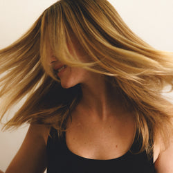 Image of woman enjoying her clean, healthy hair