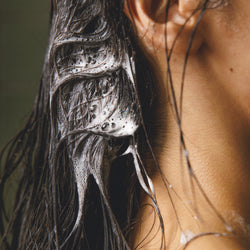 Image showing a woman using Daily Hydration Hydrating Shampoo in her hair
